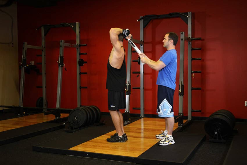 Standing Towel Triceps Extension: start and finish position